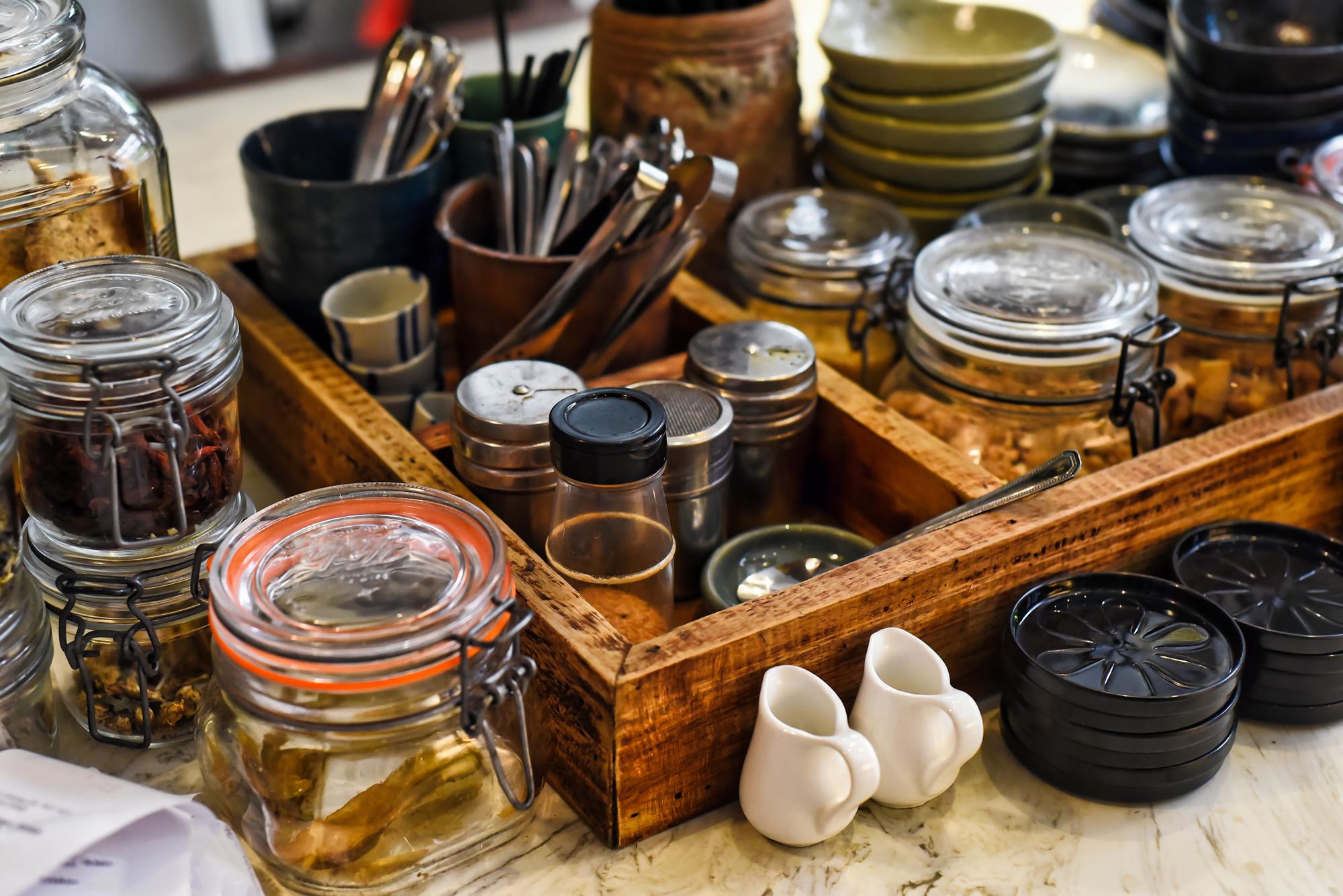 Small production kitchen with jars and utensils